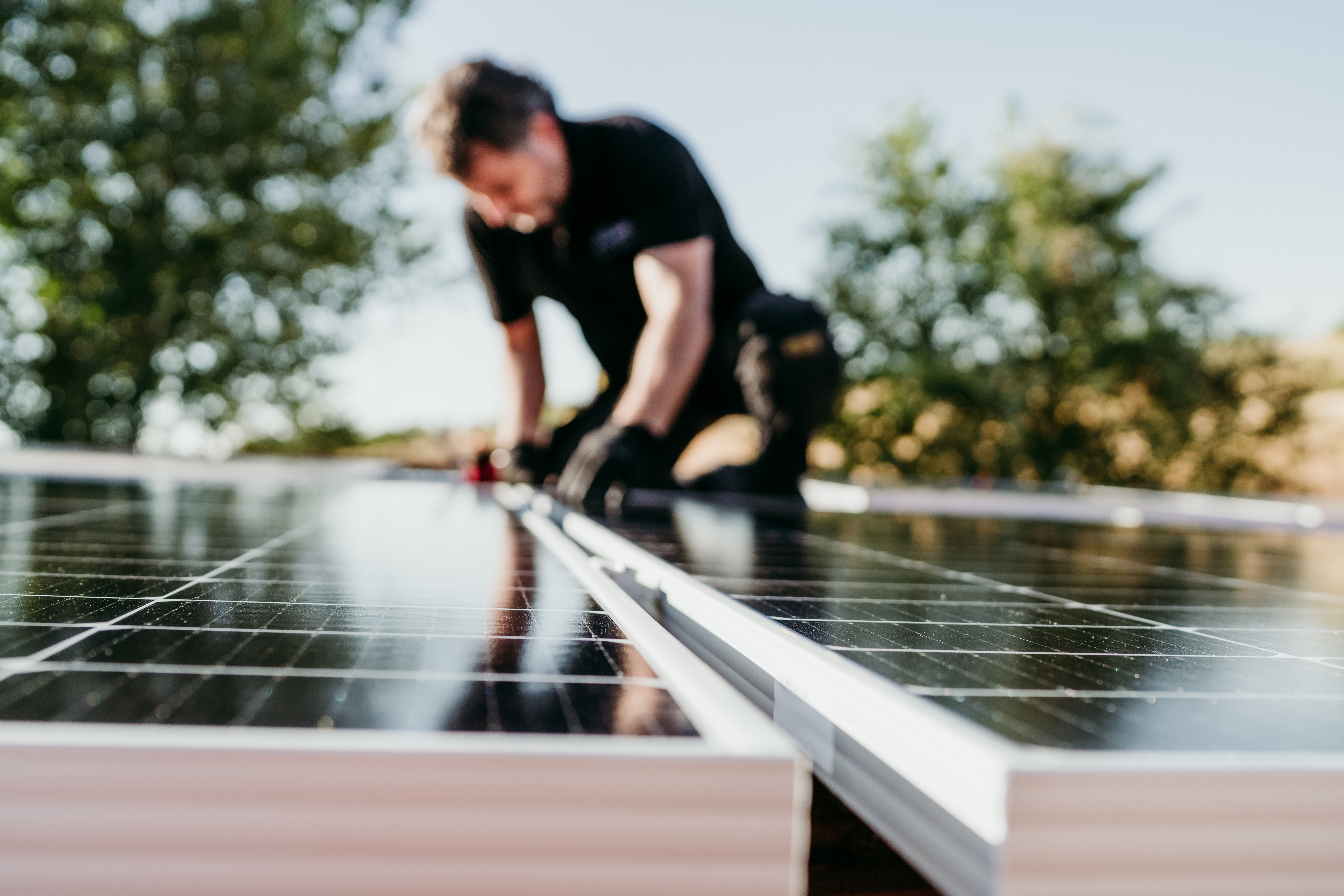 technician-assembling-solar-panels-on-house-roof-f-2022-10-11-20-15-32-utc.jpg